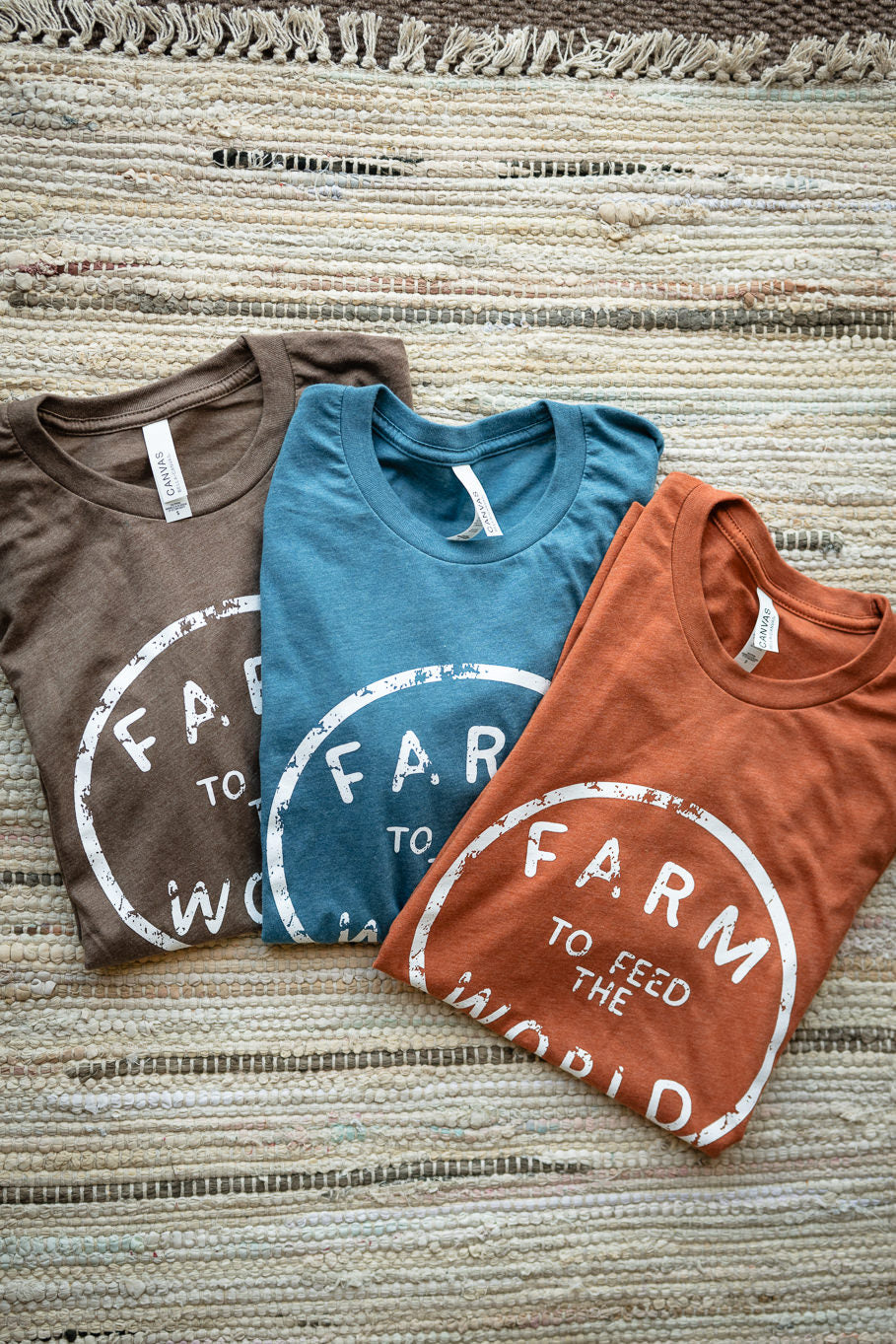 Feed the World Graphic Tee in Heather Brown | Sizes S - 3XL